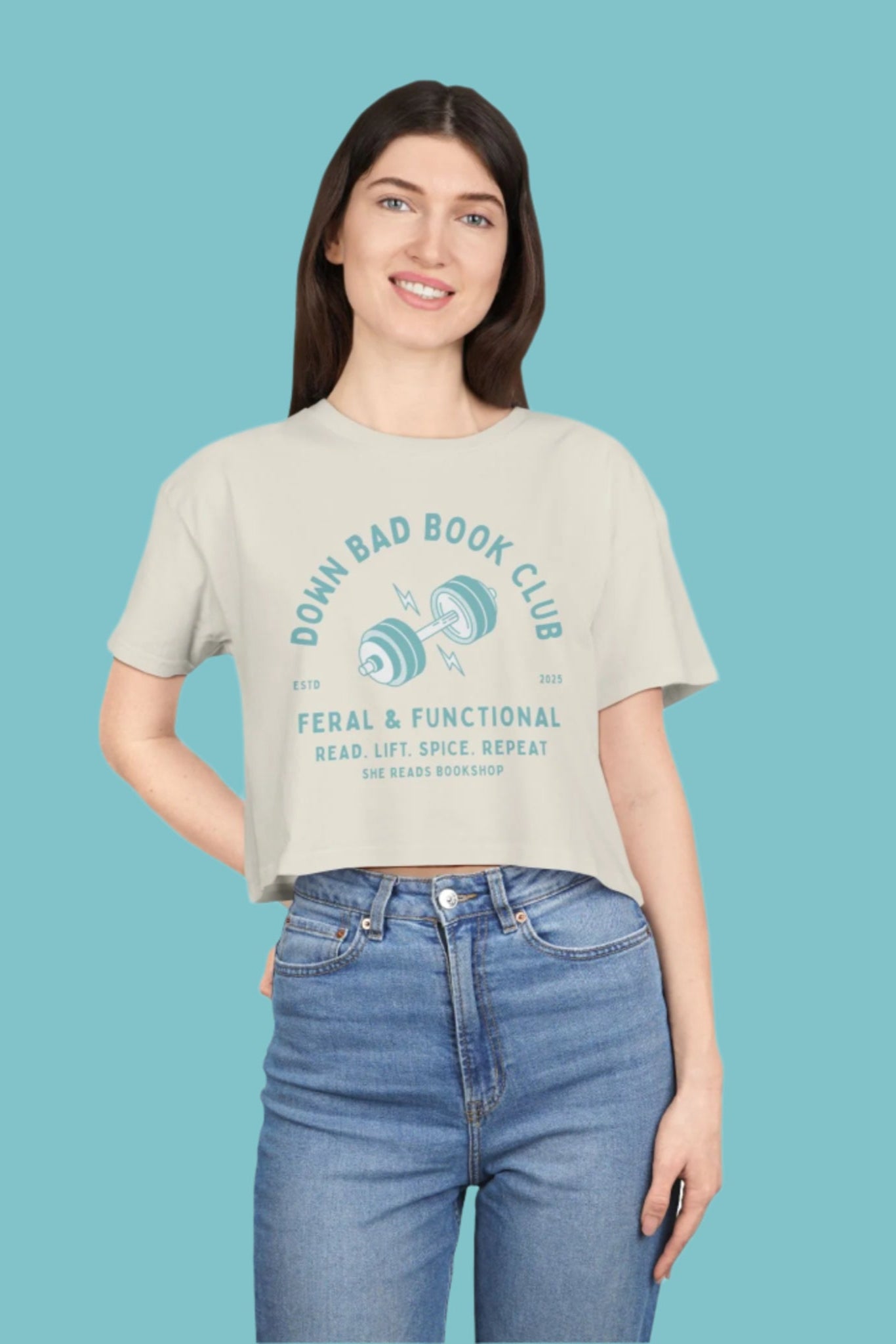 Person wearing a t-shirt with 'Down Bad Book Club' text and graphic on a blue background