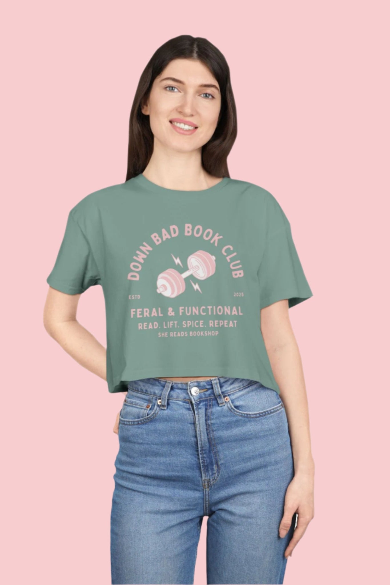 Woman wearing a green t-shirt with text and graphics on a white background