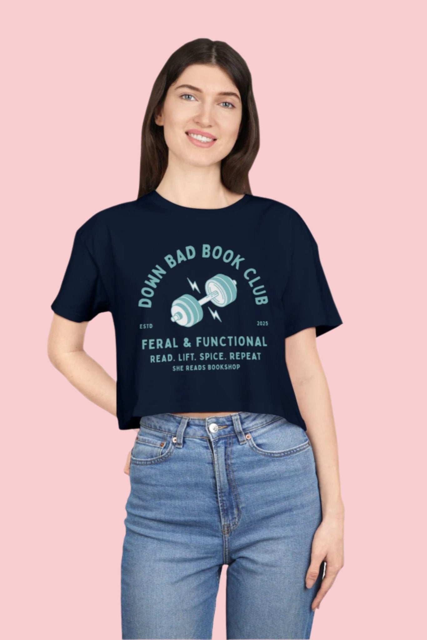 Person wearing a navy blue t-shirt with text and graphic design on a white background