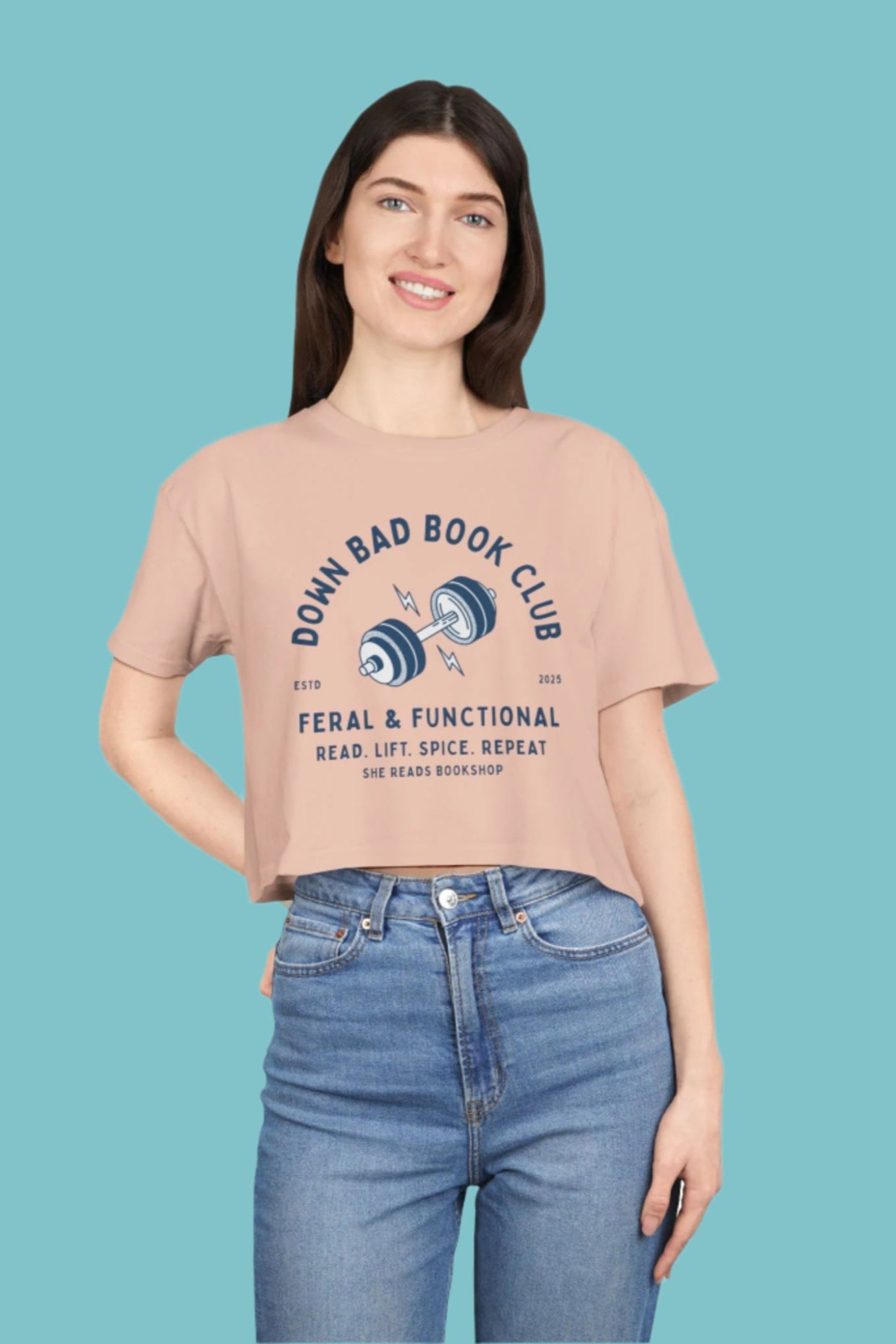 Person wearing a beige t-shirt with text and graphics on a blue background